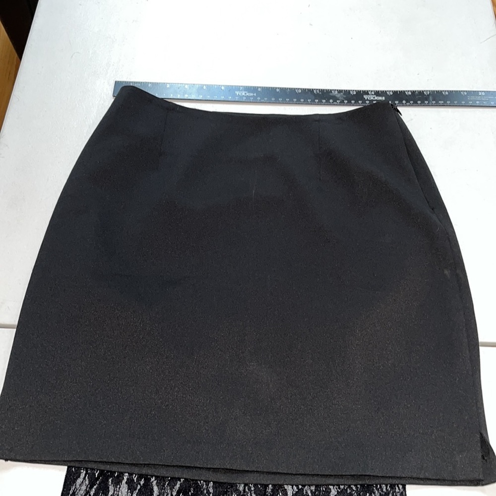 Guess size 10 black mini  skirt above the knee with sheen like new